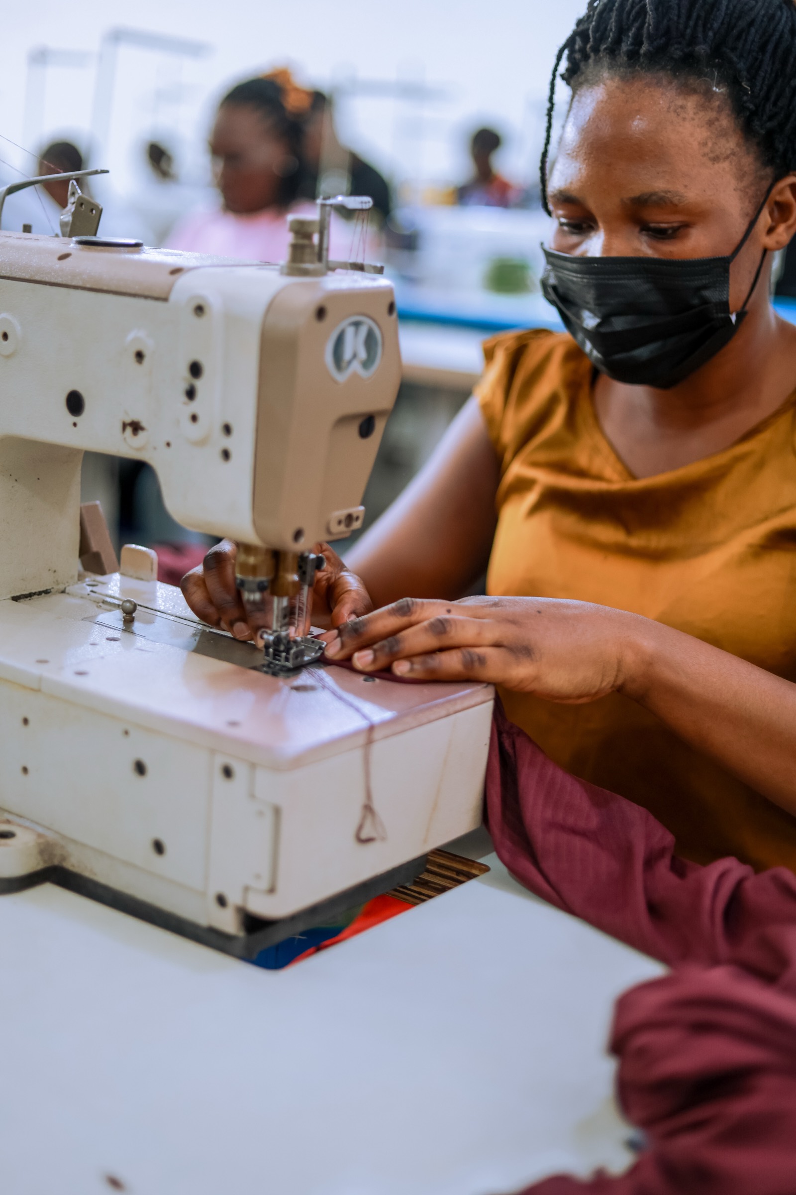 Seamstress at work in the Waya Collective factory